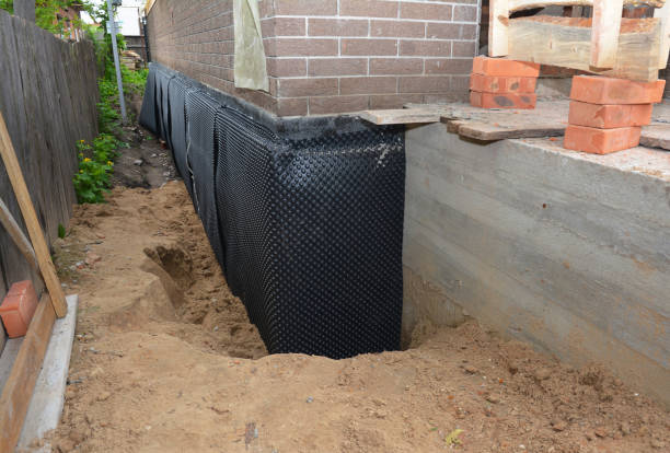 Happy homeowners after waterproofing job in Catlett